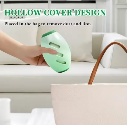 Green Portable Pet Hair Roller placed in a bag to remove dust and lint, with text on a blurred indoor background.